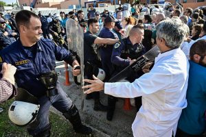 In Pictures: Tear Gas and Protests Greet PM at Athens Hospital