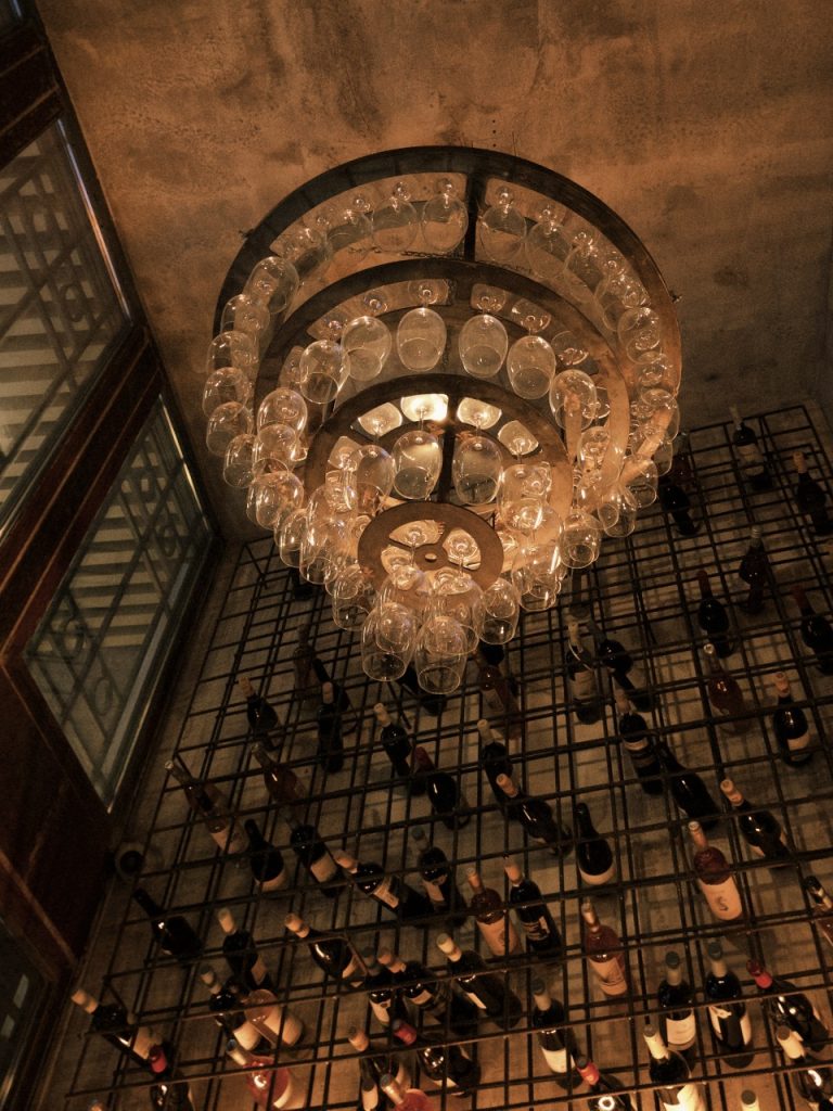 Bar interior of Thamai Spritzeria in Athens with vibrant spritz cocktails and Italian small plates.