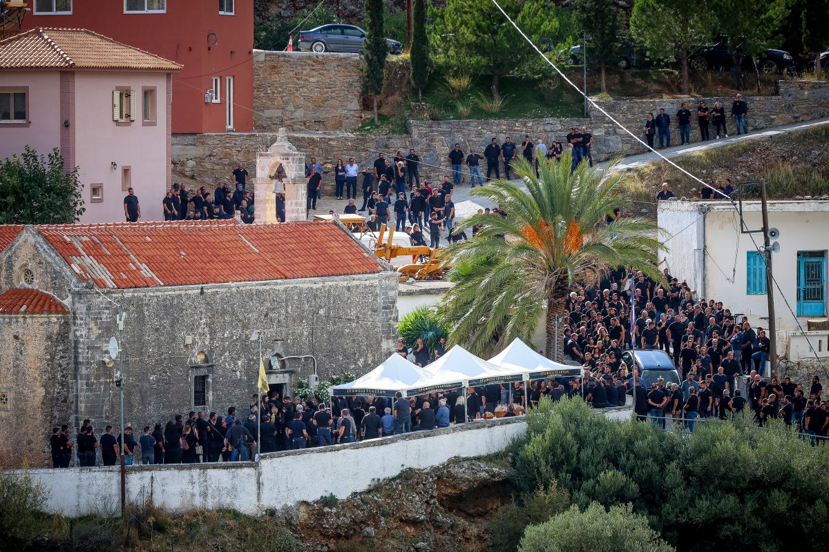 Second Funeral Held Amid Police Hunt After Crete Shootout