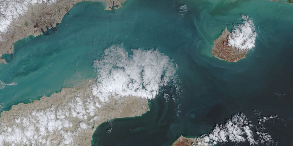 Iran Tightens Hormuz Control; Ships Hit by Gunfire