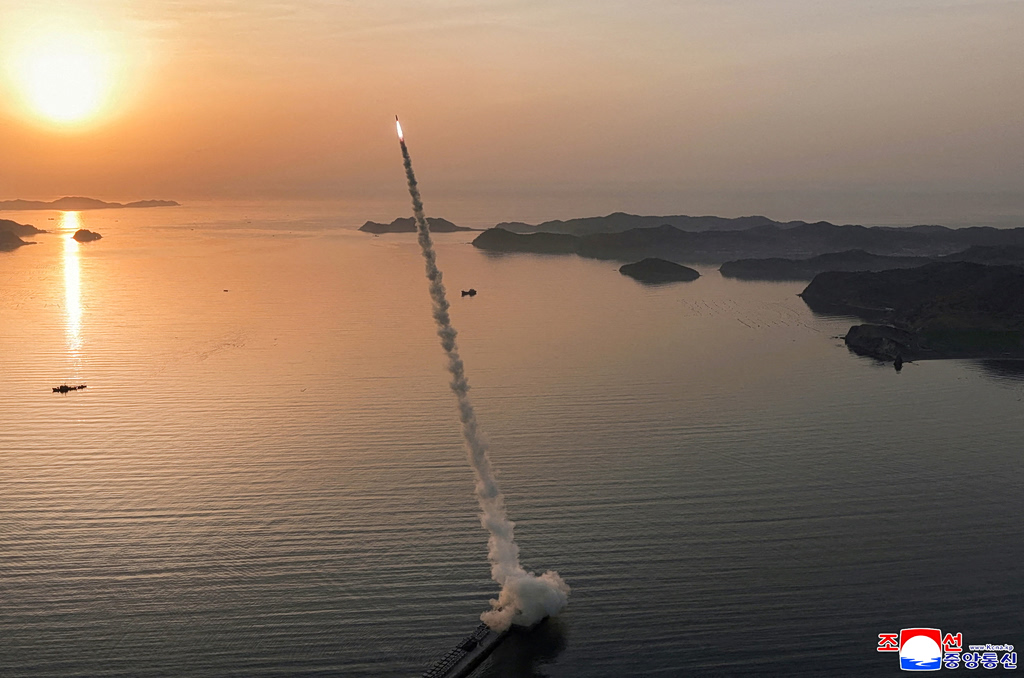 Kim Jong Un Oversees Missile Tests with Cluster Warheads