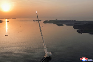 Kim Jong Un Oversees Missile Tests with Cluster Warheads