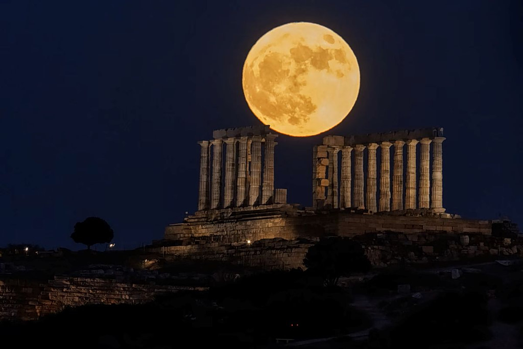 In Pictures: Strawberry Moon Illuminates Greece in Spectacular Display