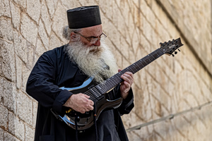 A Priest, a Guitar and a New View of God