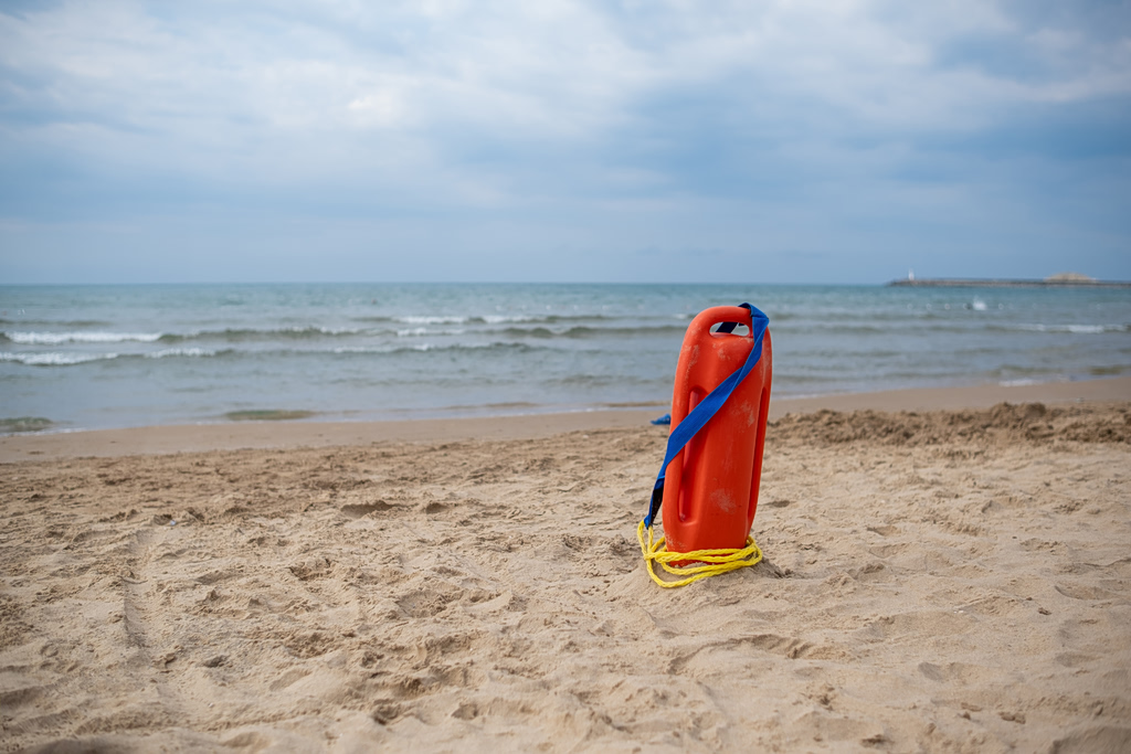 Lifeguard Battles Waves to Rescue Woman