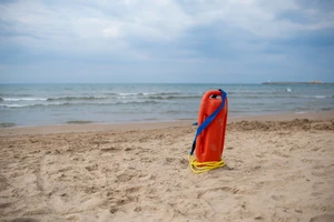 Lifeguard Battles Waves to Rescue Woman