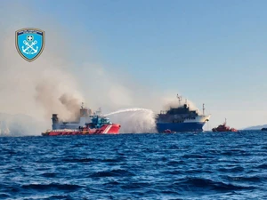 Crews Work to Stabilize Blue Carrier 2, Fire Partially Contained