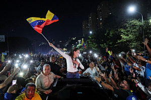 Venezuela’s Machado Returns Home, Challenging U.S.-Backed Government